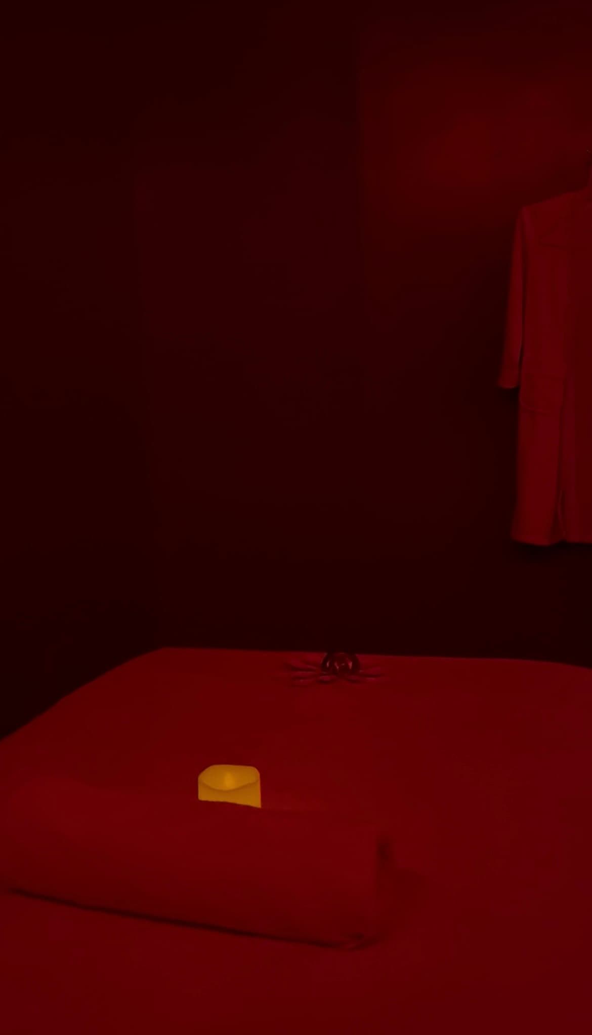 The lighting is very moody and the room is minimalist and stark 